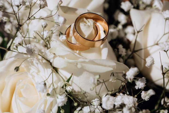 golden wedding rings white rose from wedding bouquet 11zon